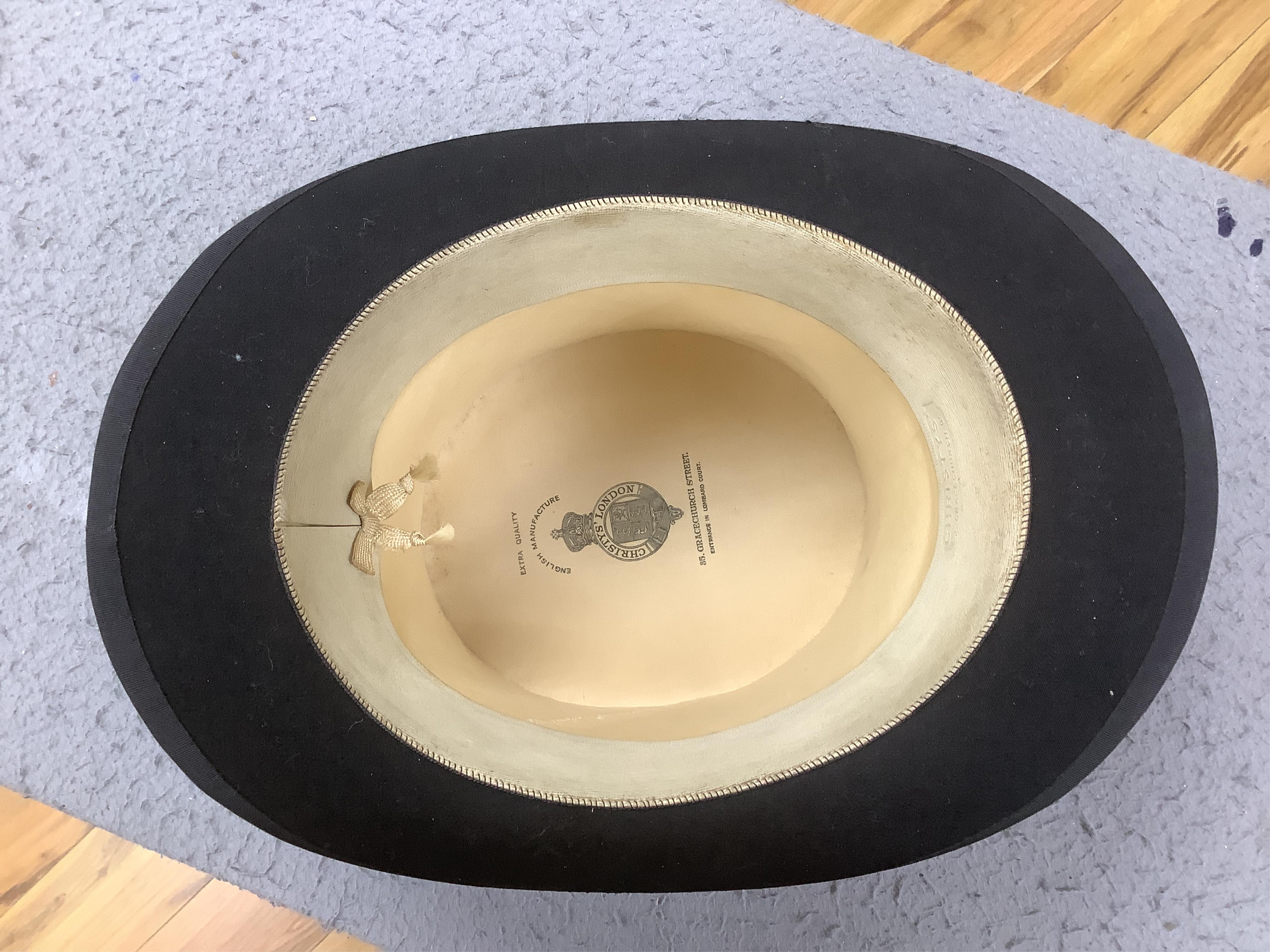 Three gentlemen’s black silk top hats and a similar grey top hat and box. Condition - grey hat good, others poor